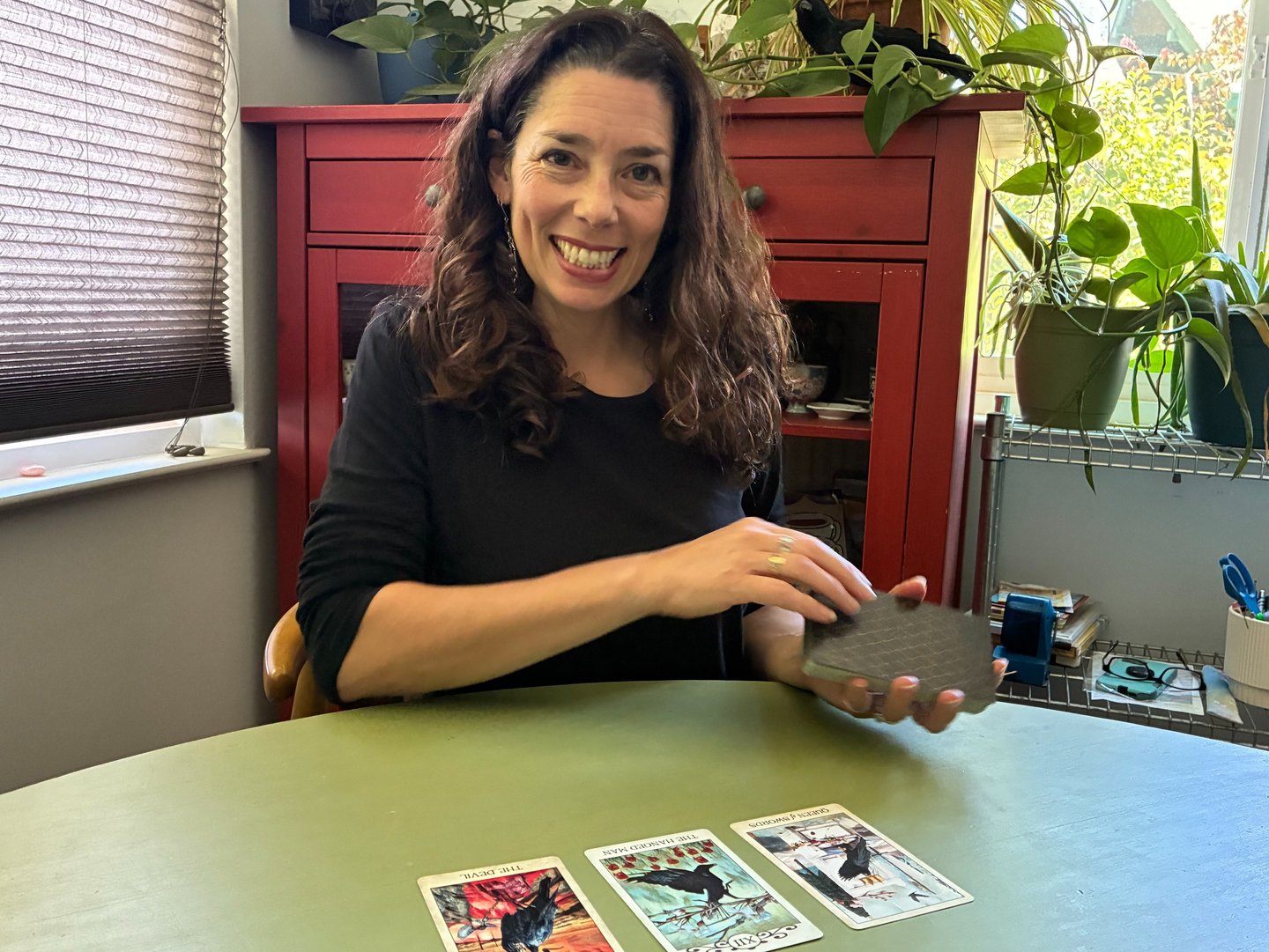 Picture of Colleen smiling and laying out cards