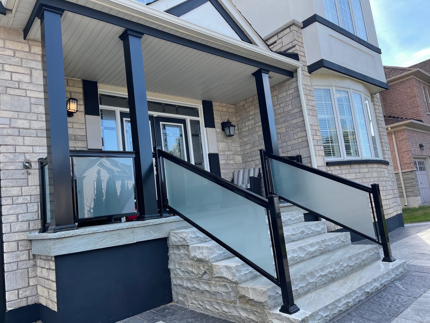 frosted glass railings with columns in driveway