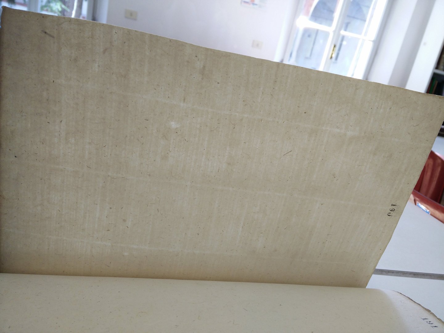 Markings from the wire sieve mould on a paper record from 14th century Parma.