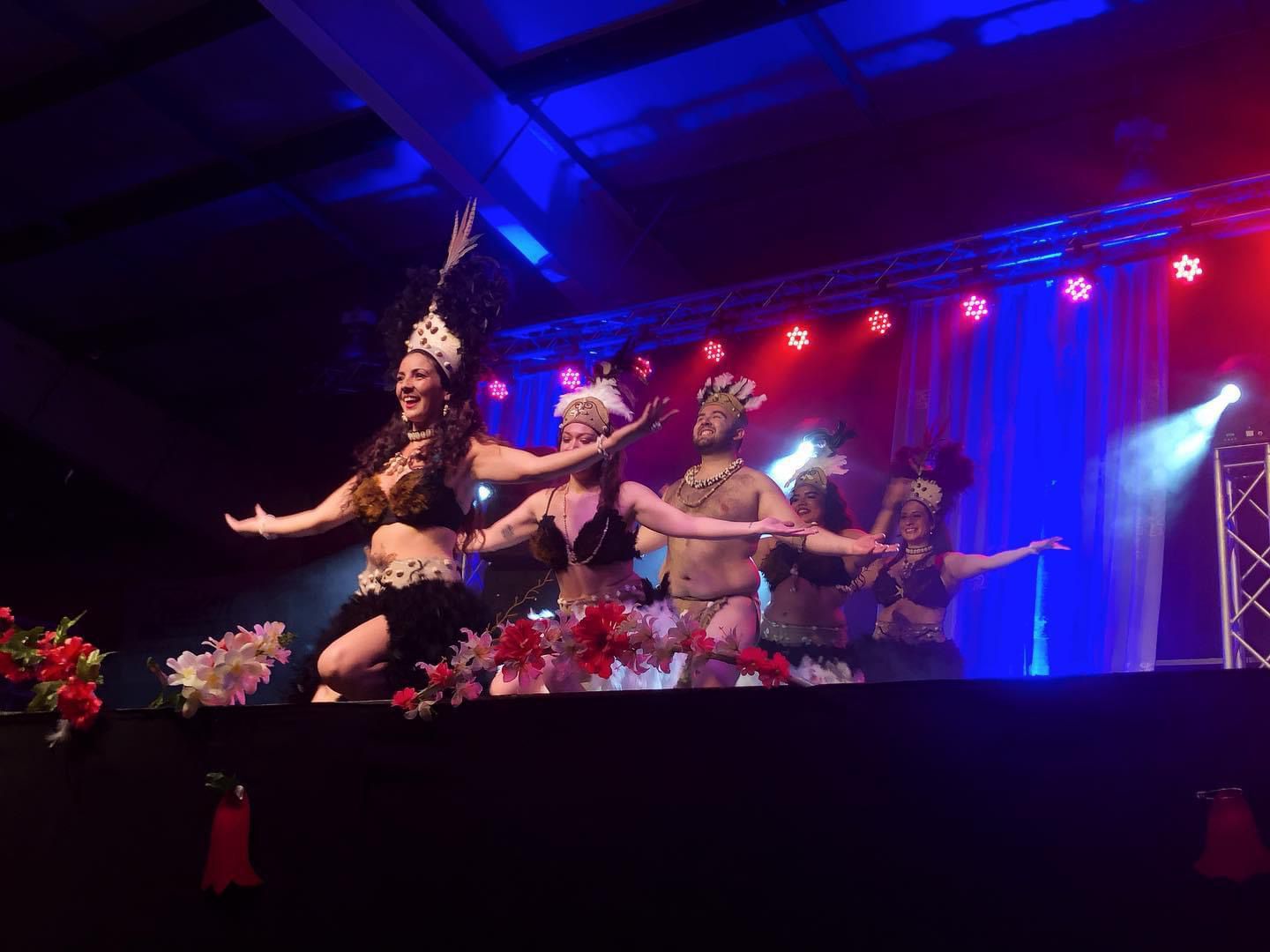 a group of dancers performing a show