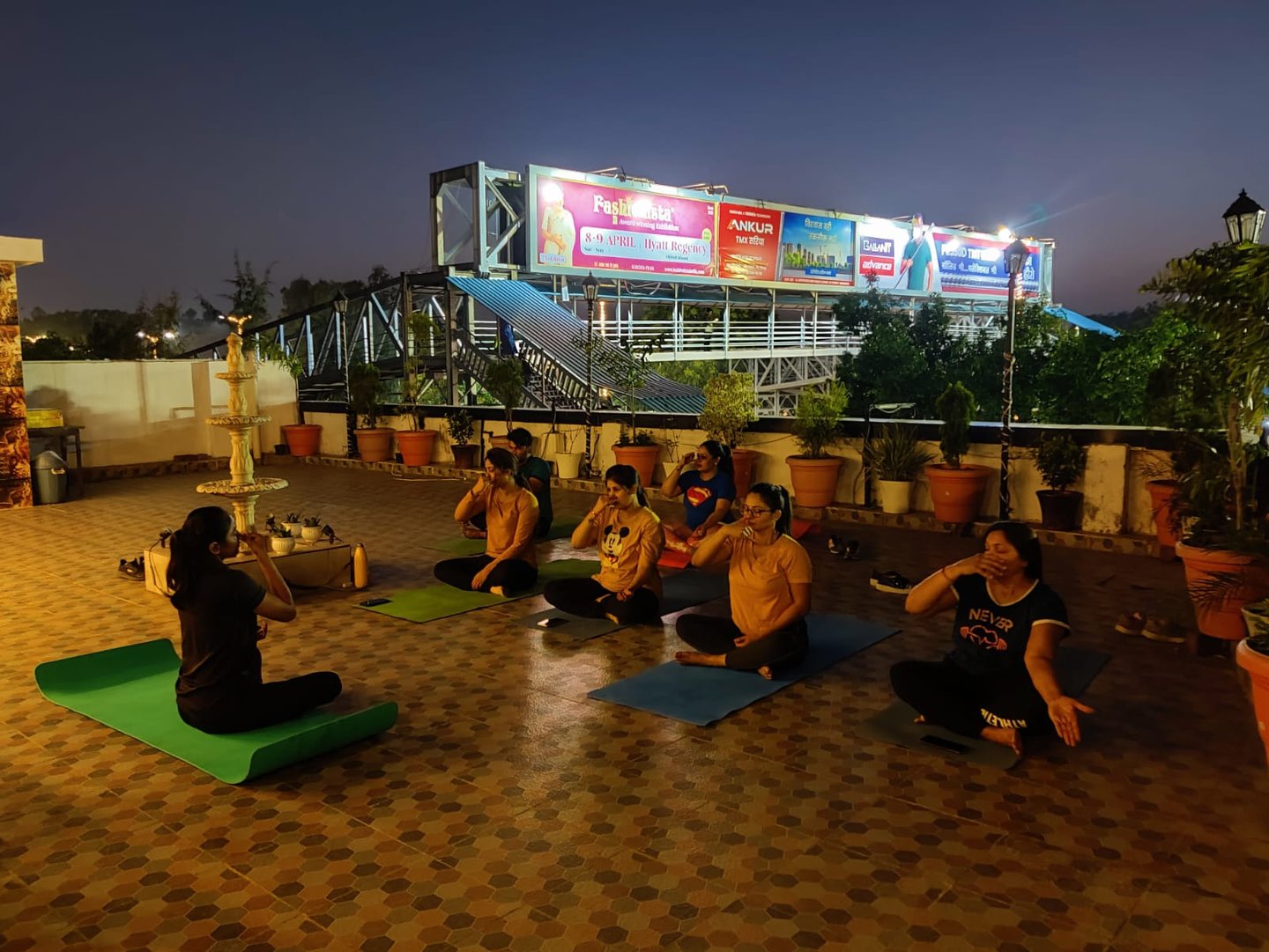 a group of people sitting on top of a roof