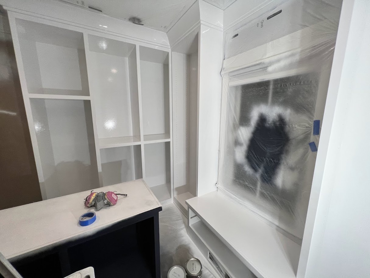Custom refinished white built-in closet with a smooth, professional finish, enhancing storage space