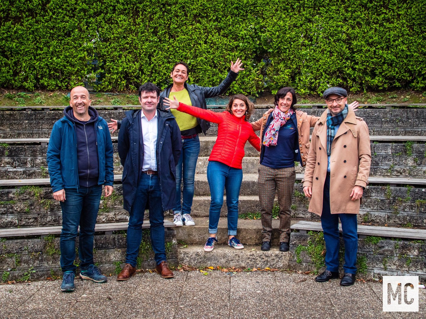 a group of people standing around a group of people