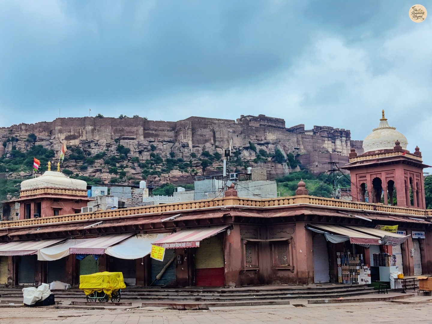 Mehrangarh Fort towering above the closed shops of Sardar Market in Jodhpur’s Blue City on a peaceful morning.