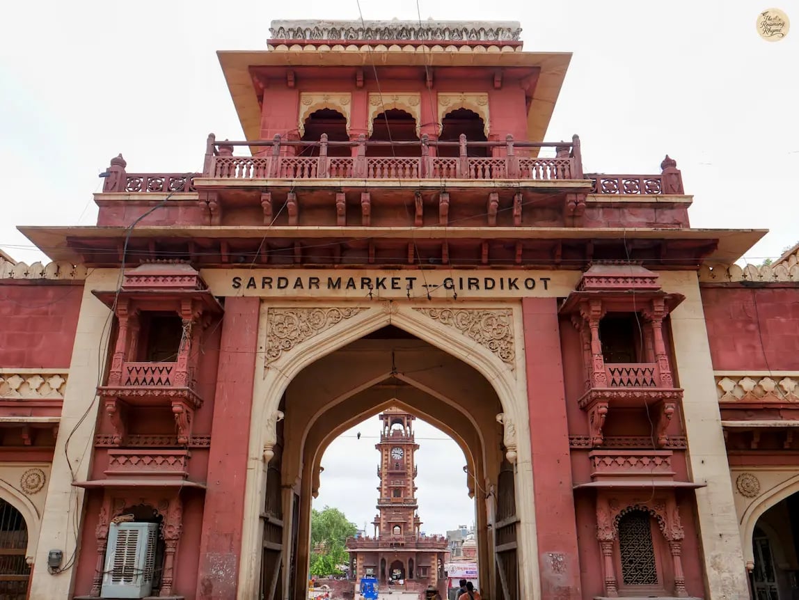 Entry gate of Sardar Market Jodhpur with iconic Clock Tower visible through the arch, showcasing heritage and local life.