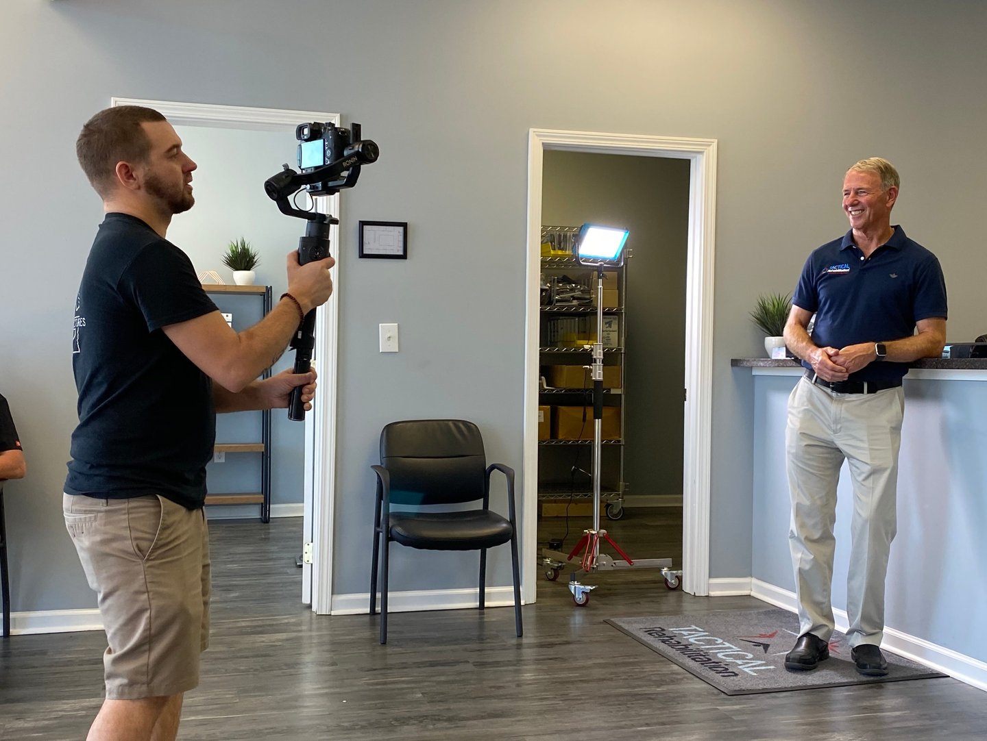 Jacksonville NC video producer Chris Lee filming on-location with professional gear.