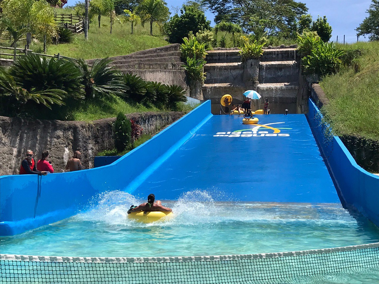a person on a surfboard in a pool