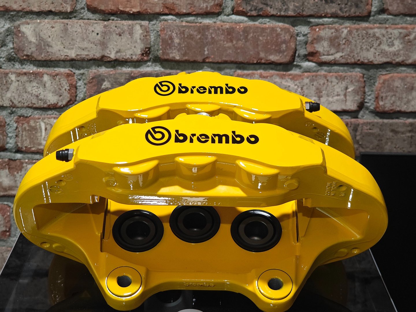 Jeep Trackhawk calipers restored in Signal Yellow powdercoat