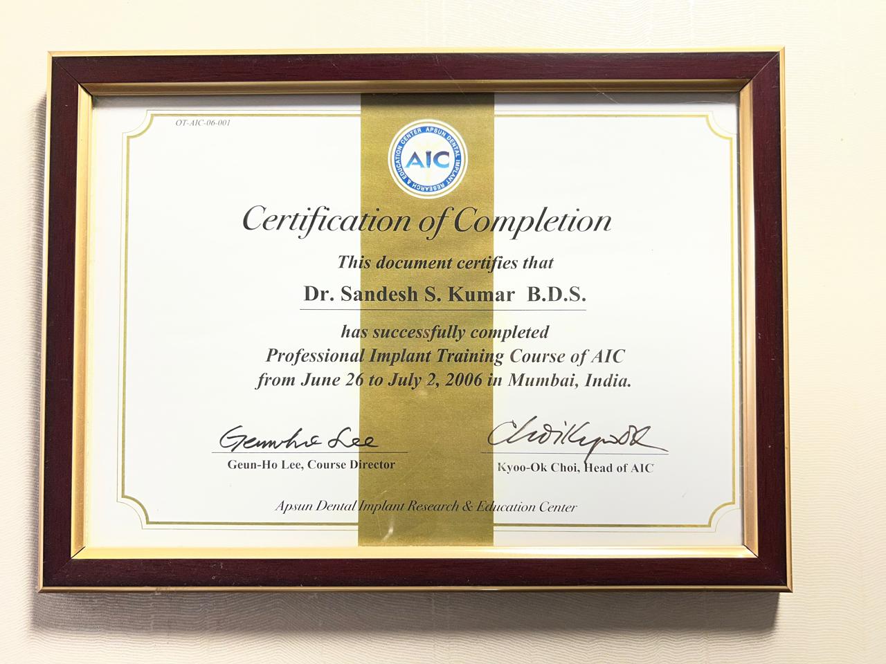 Dr. Sandesh S. Kumar's B.D.S. Professional Implant Training Course certification of completion from AIC Mumbai.