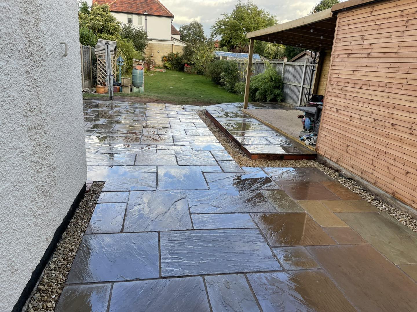 Levelled patio slabs in Worcester garden by B R Building and Landscapes