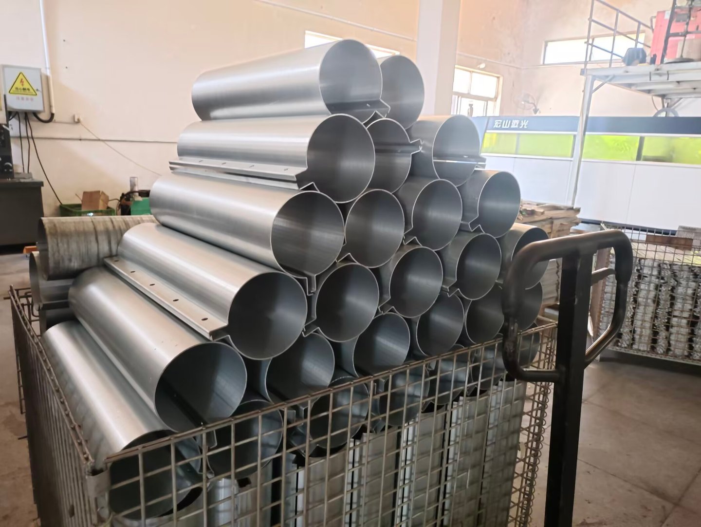 Stack of hollow aluminum tubes bending metal fabrication factory.