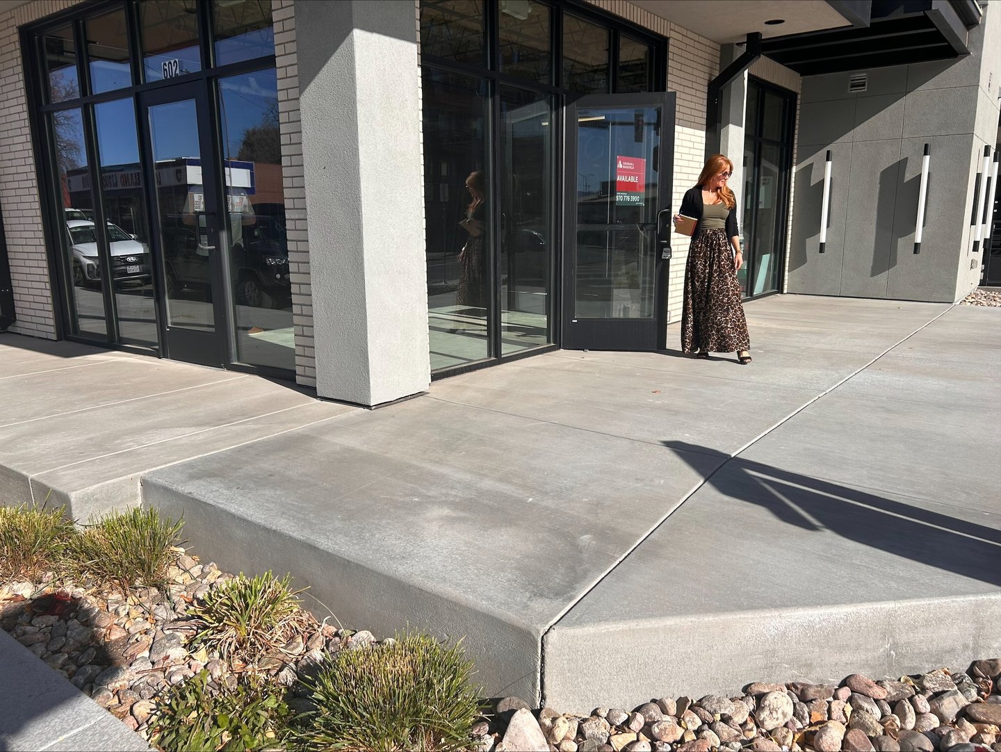 Owner Mindy Bryant standing in front of the new Loveland Edge Optics location