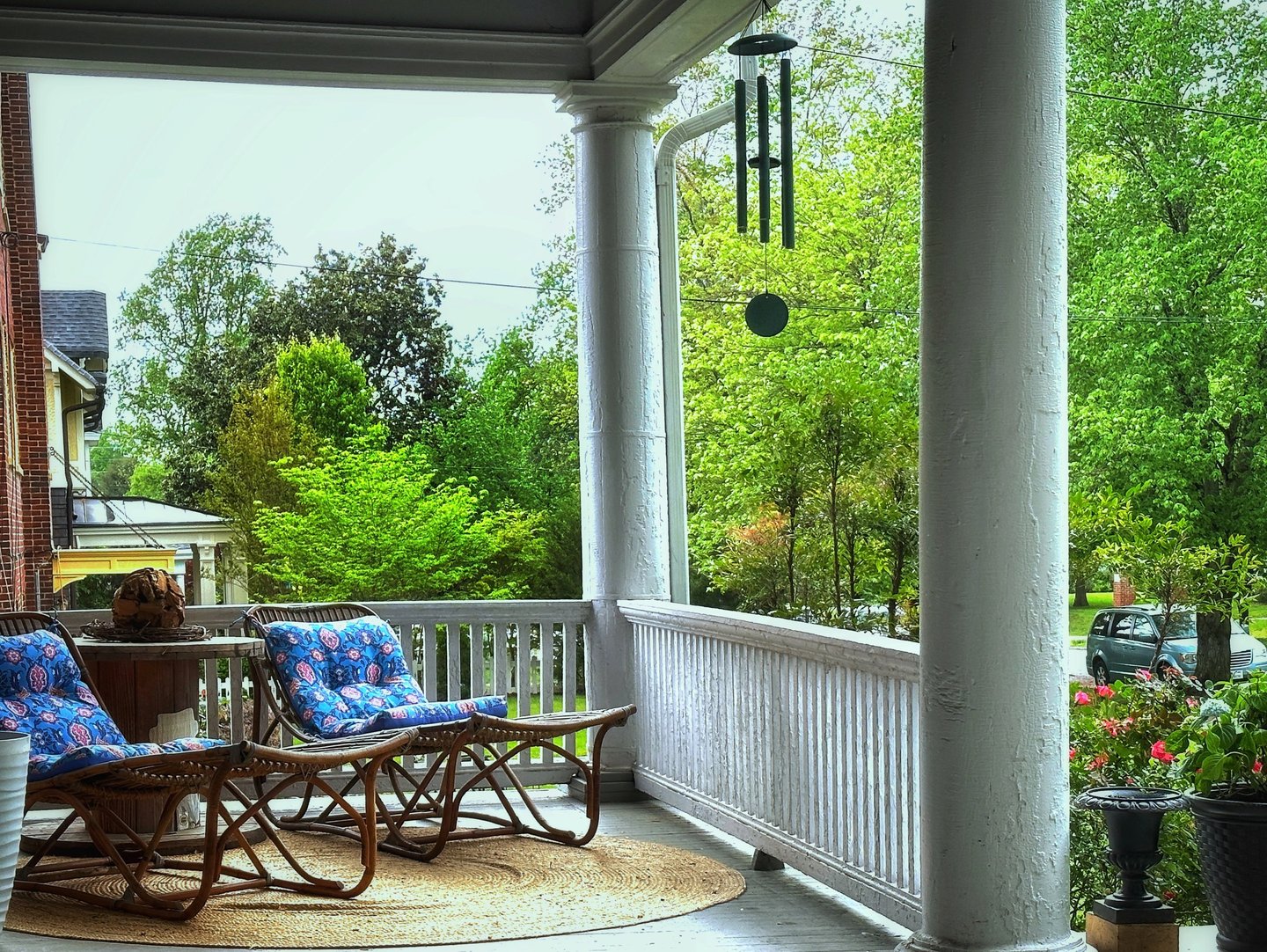 front porch with loungers and wind chimes 2123 Rivermont