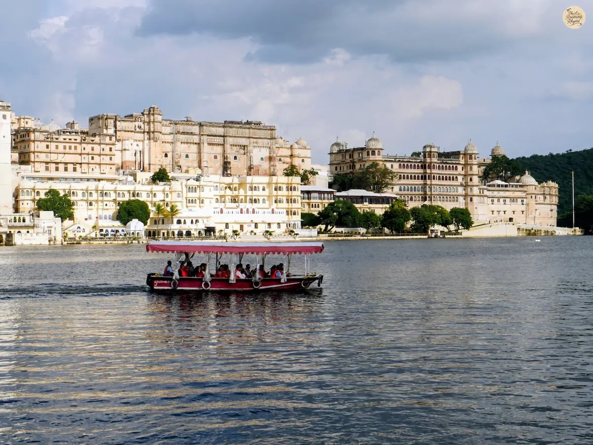 Boat ride on Lake Pichhola with City Palace Udaipur in the background.