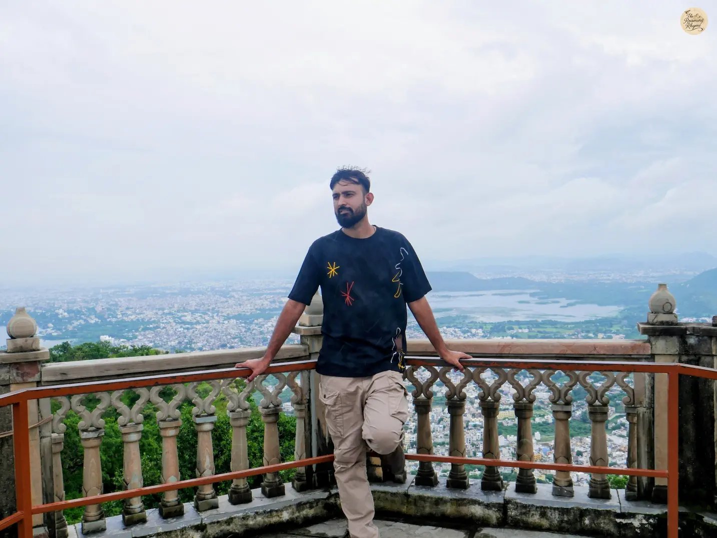 View of Udaipur town with shimmering lakes from hilltop Sajjangarh Monsoon palace Udaipur Rajasthan