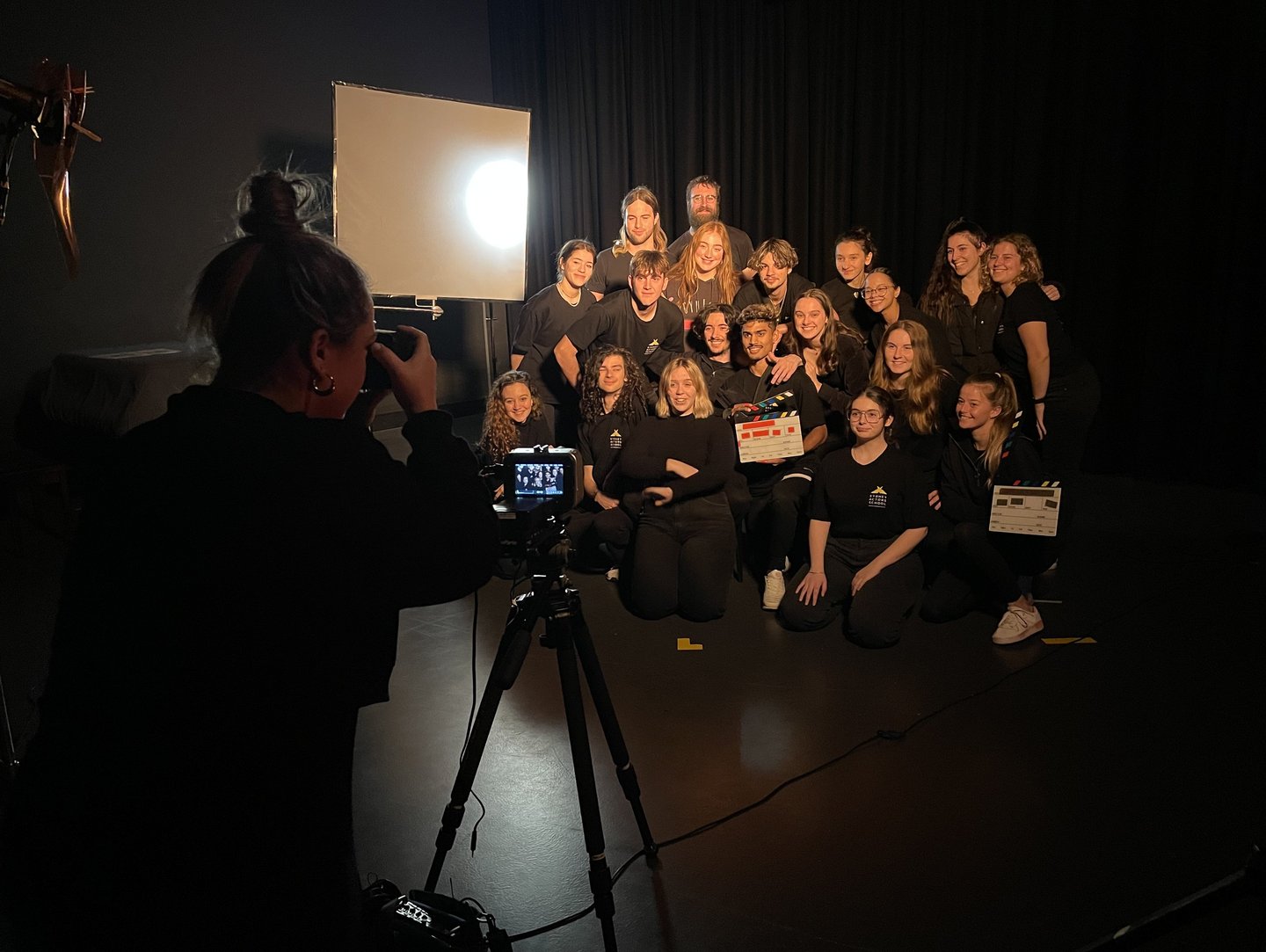 a group of people posing for a photo