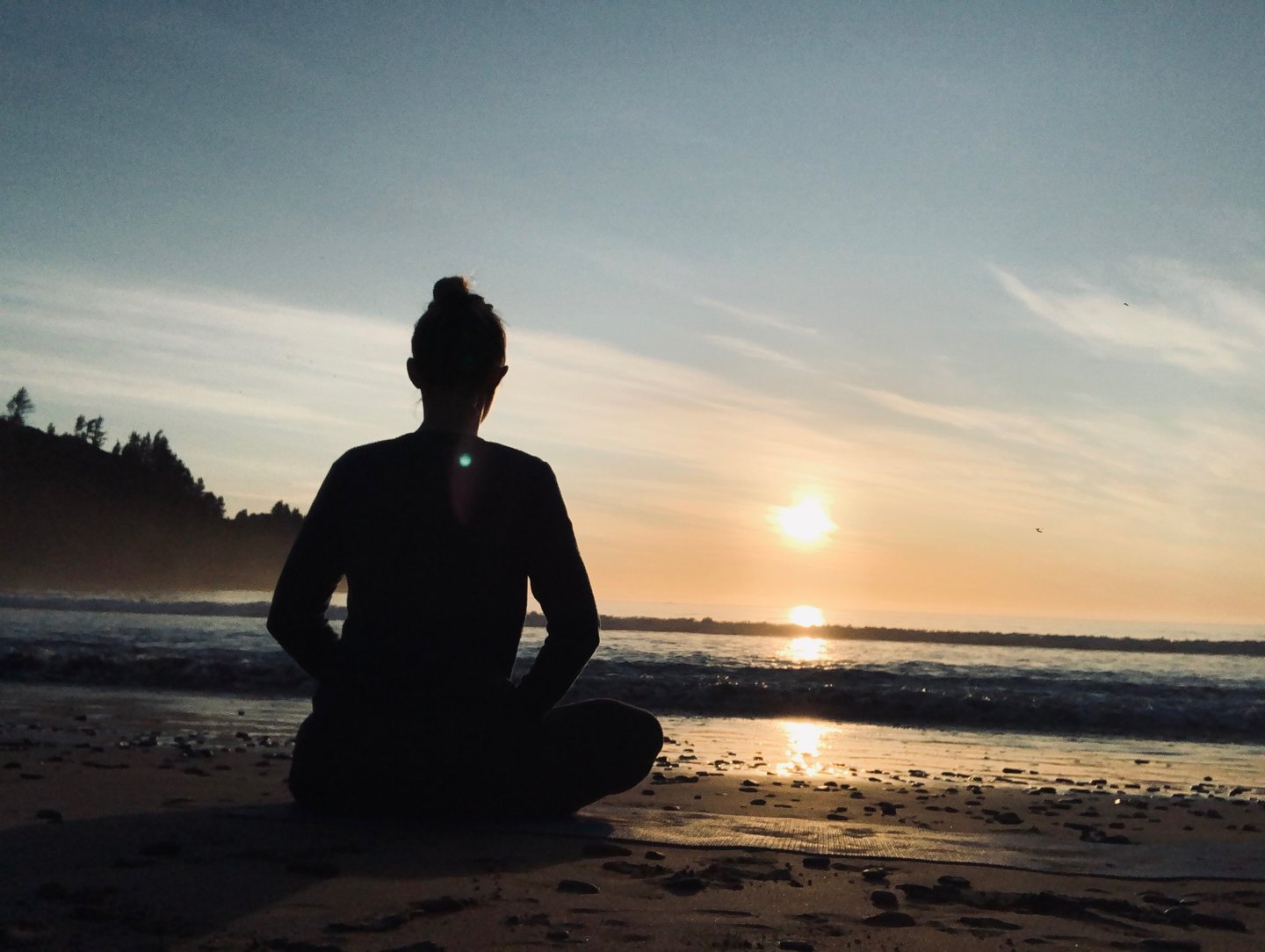 Meditating on a beach in New Zealand with it's fire energy