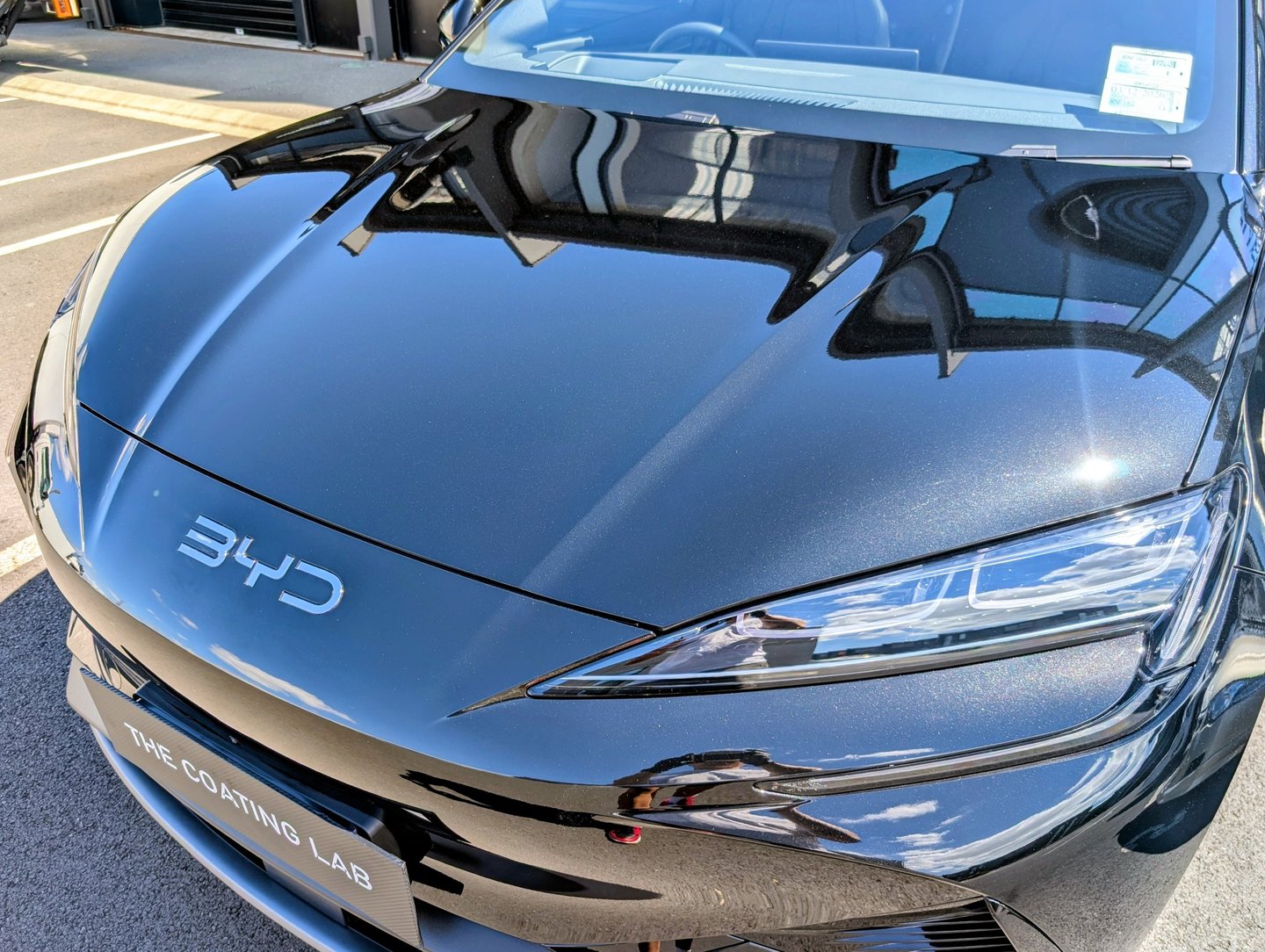 A black BYD electric car with a glossy ceramic coating finish applied by The Coating Lab Auckland