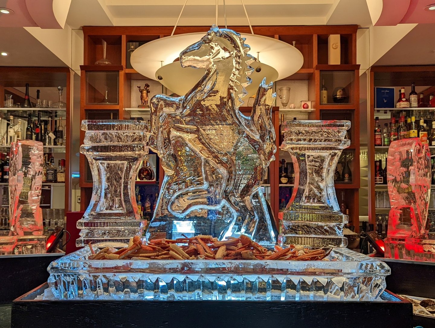 ice sculpture of a horse with an ice tray for seafood
