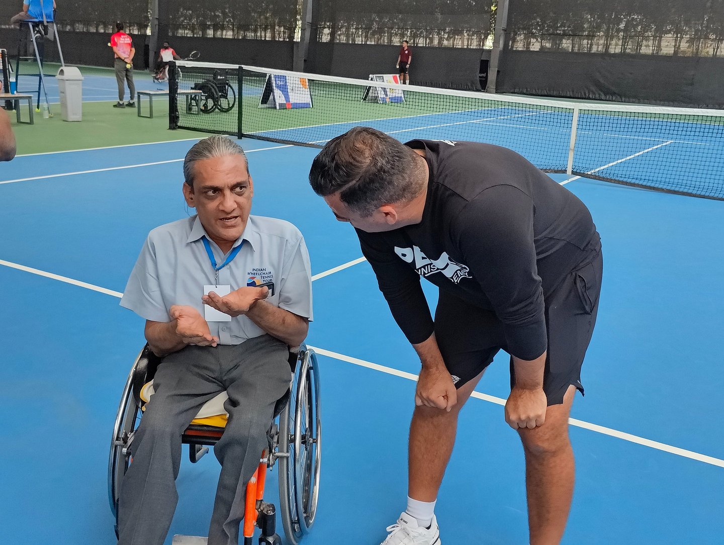 Wheelchair athletes and tennis players working wtih Cesar Performance Coach