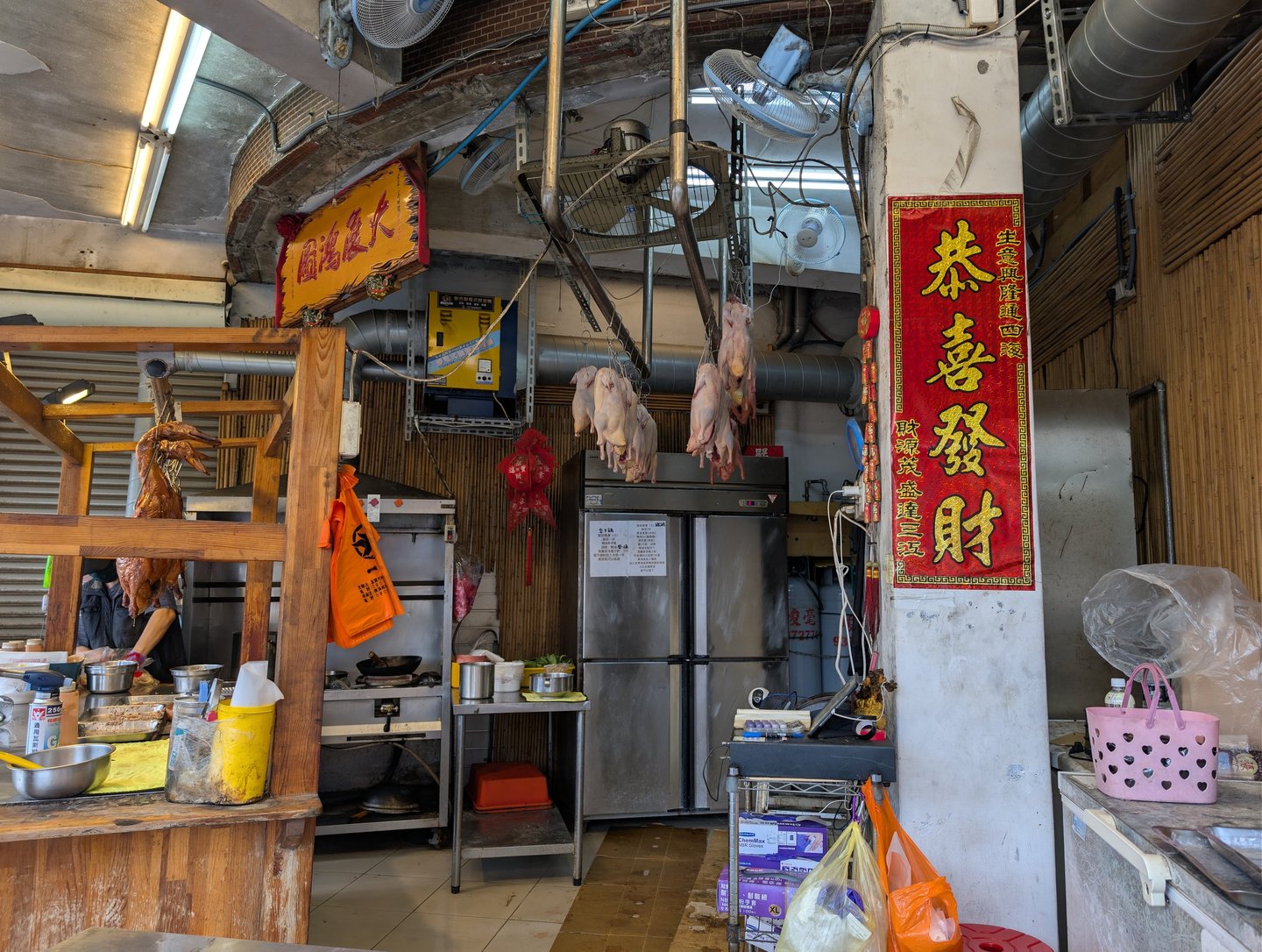 Roasted ducks hanging in a traditional Taiwanese restaurant kitchen in Yilan, Taiwan