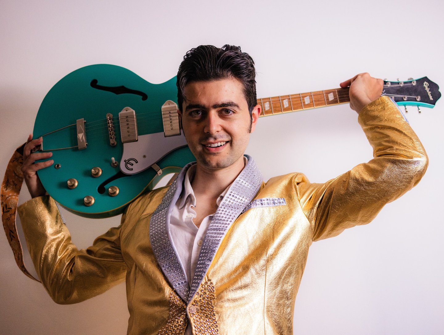 Brighton UK singer songwriter Olly Williams promotional photo with electric guitar