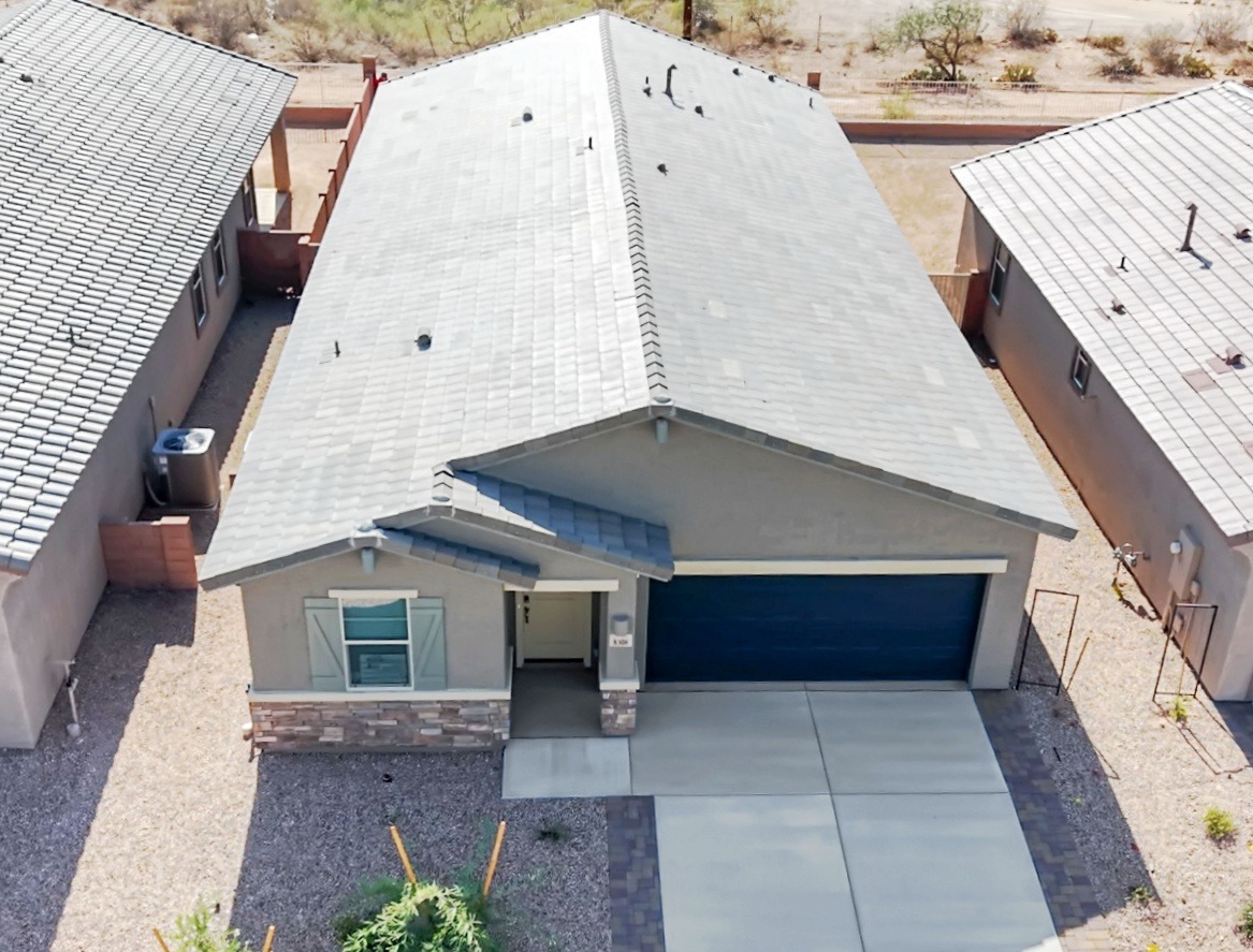a house with a garage door and a garage door
