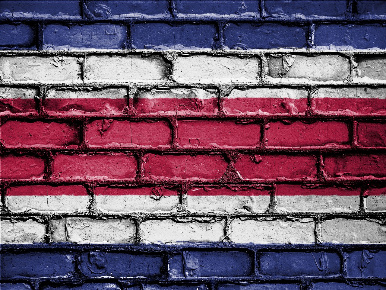 Costa Rica flag colors on brick wall