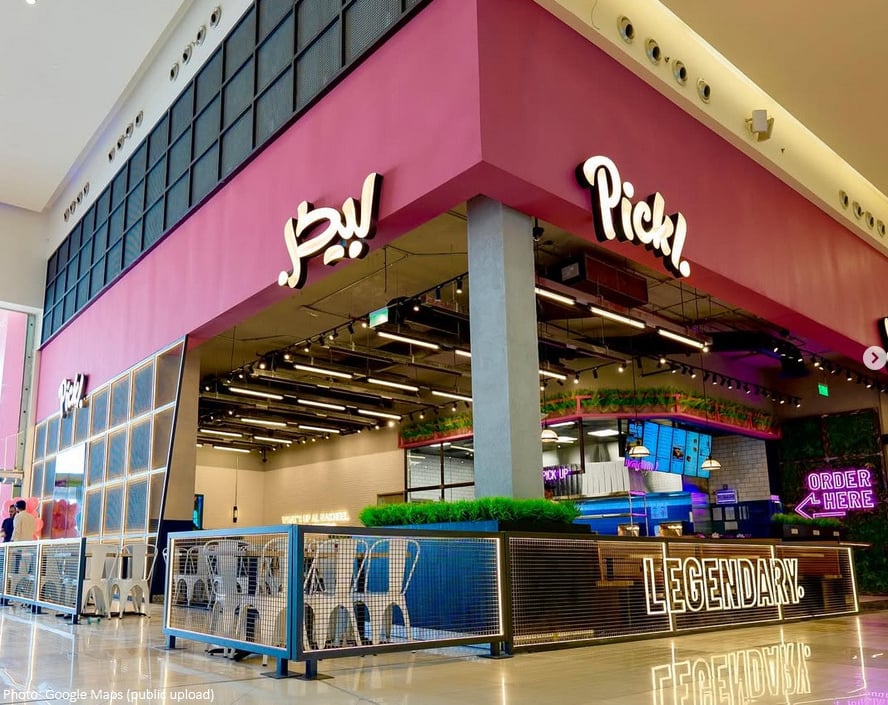 Pickl fast food branch in nakheel mall, featuring bold pink branding, sleek hospitality design, and vibrant F&B atmosphere.