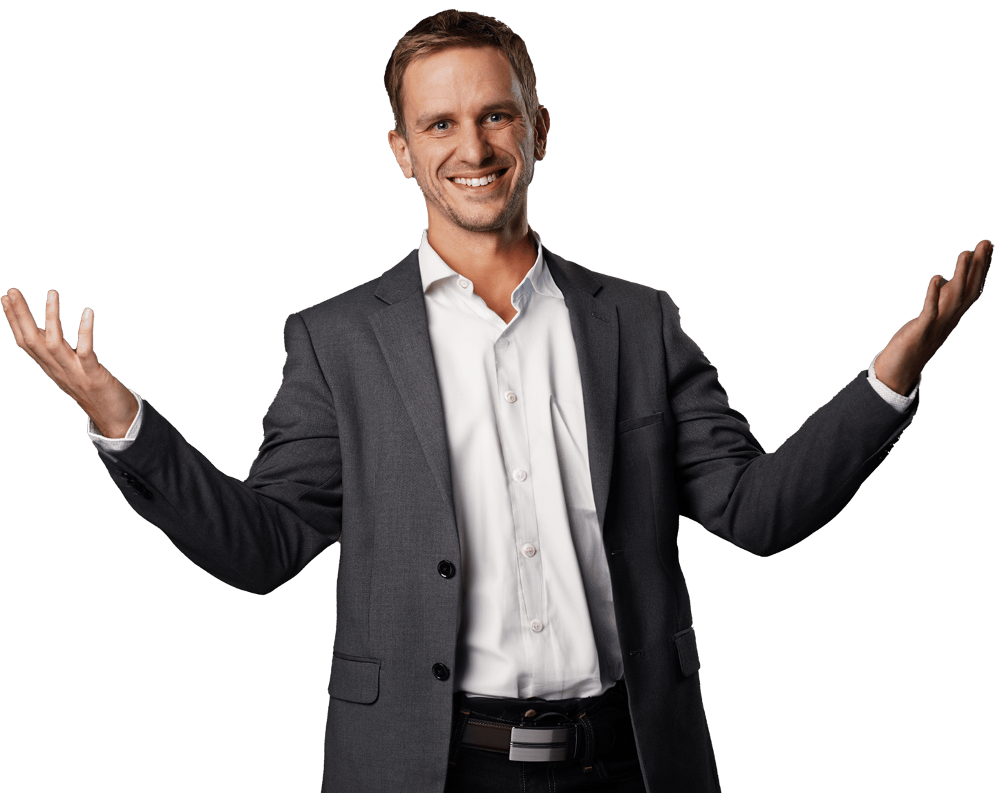 Remy ,wearing a gray blazer over a white button-up, holds his arms wide with a big smile on his face