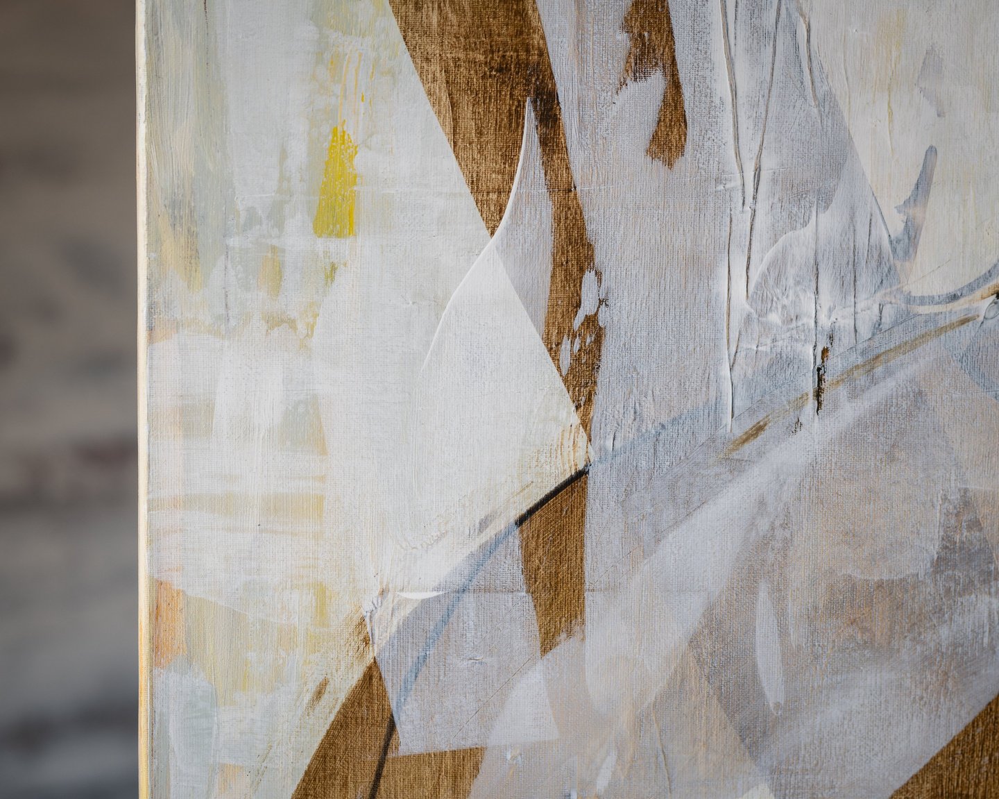 Abstract acrylic painting with textured white, brown, and yellow brushstrokes on canvas.