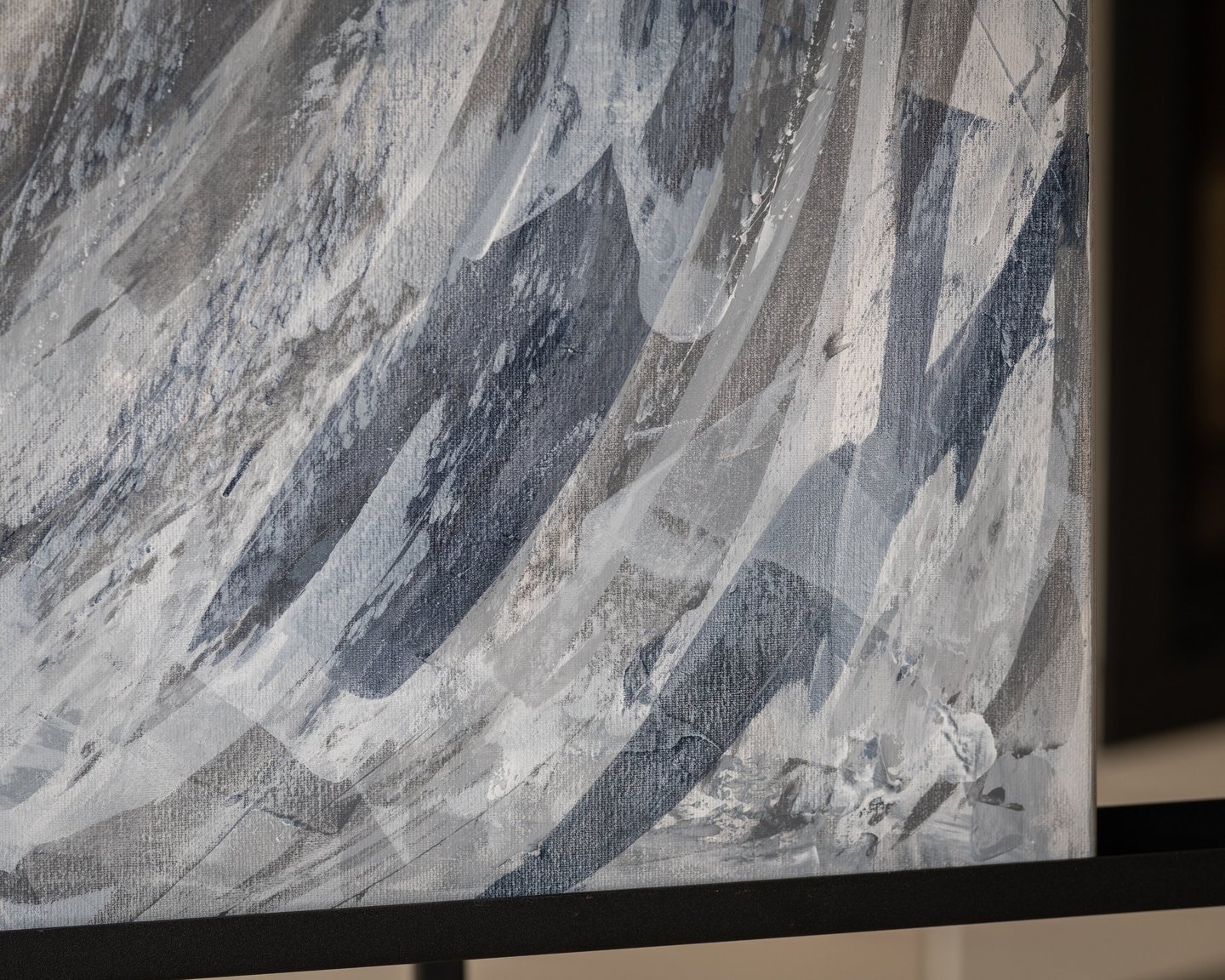 Abstract acrylic painting on canvas with textured brushstrokes in shades of gray, white, and blue.