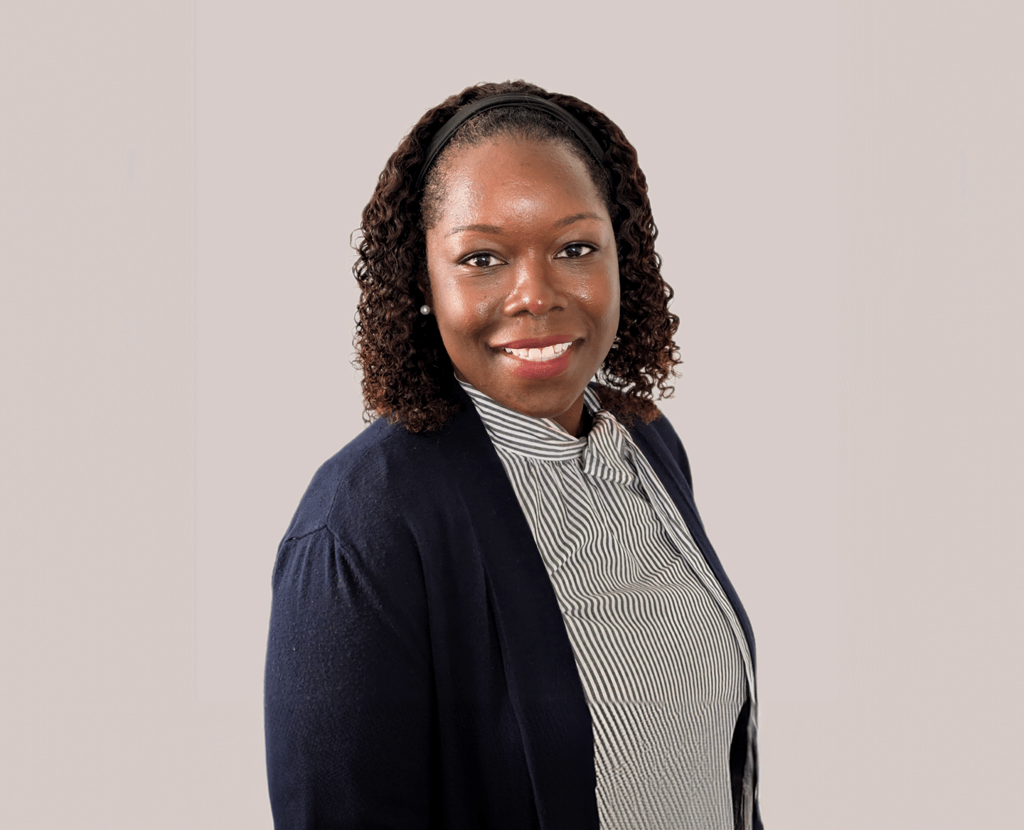 a woman in a black jacket and a white shirt