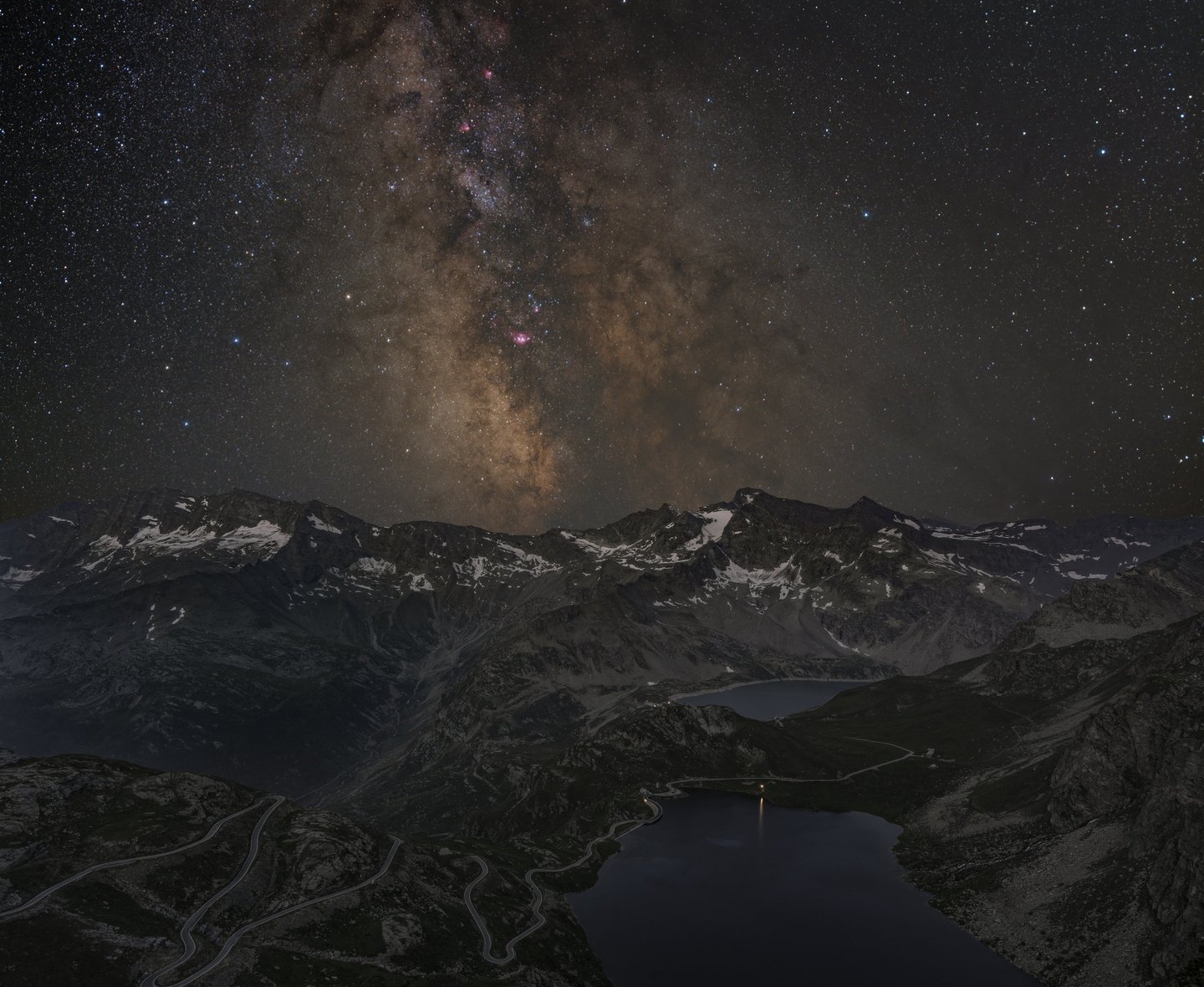 a mountain scene with a lake and a milky - like sky