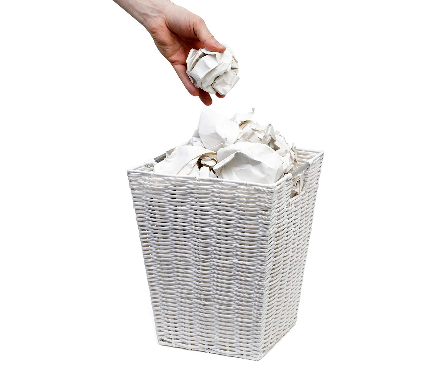 hand throwing rubbish in waste paper bin