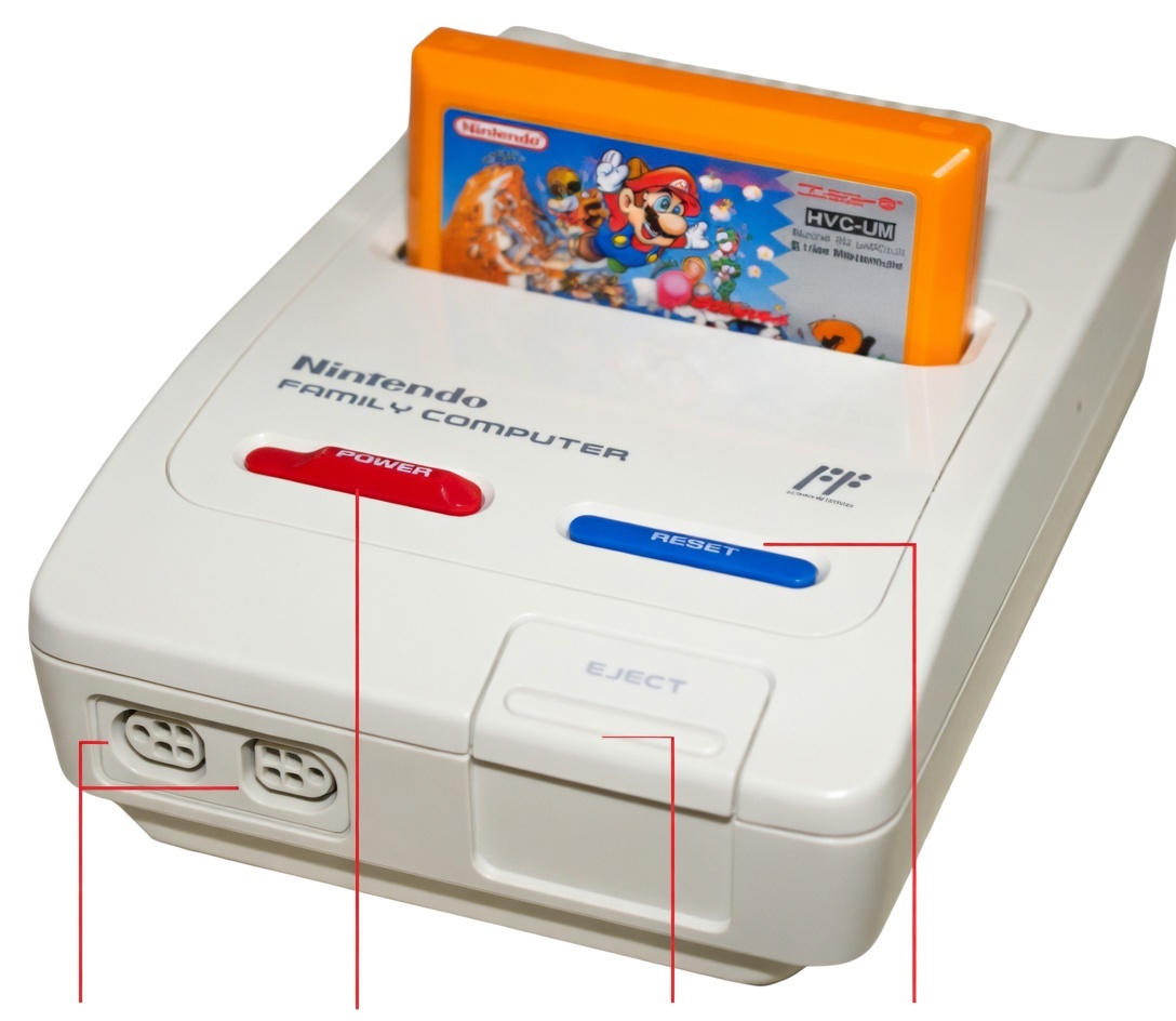 Adaptador Famicom mostrado de cima com cartucho encaixado no slot, todos os botões e conectores