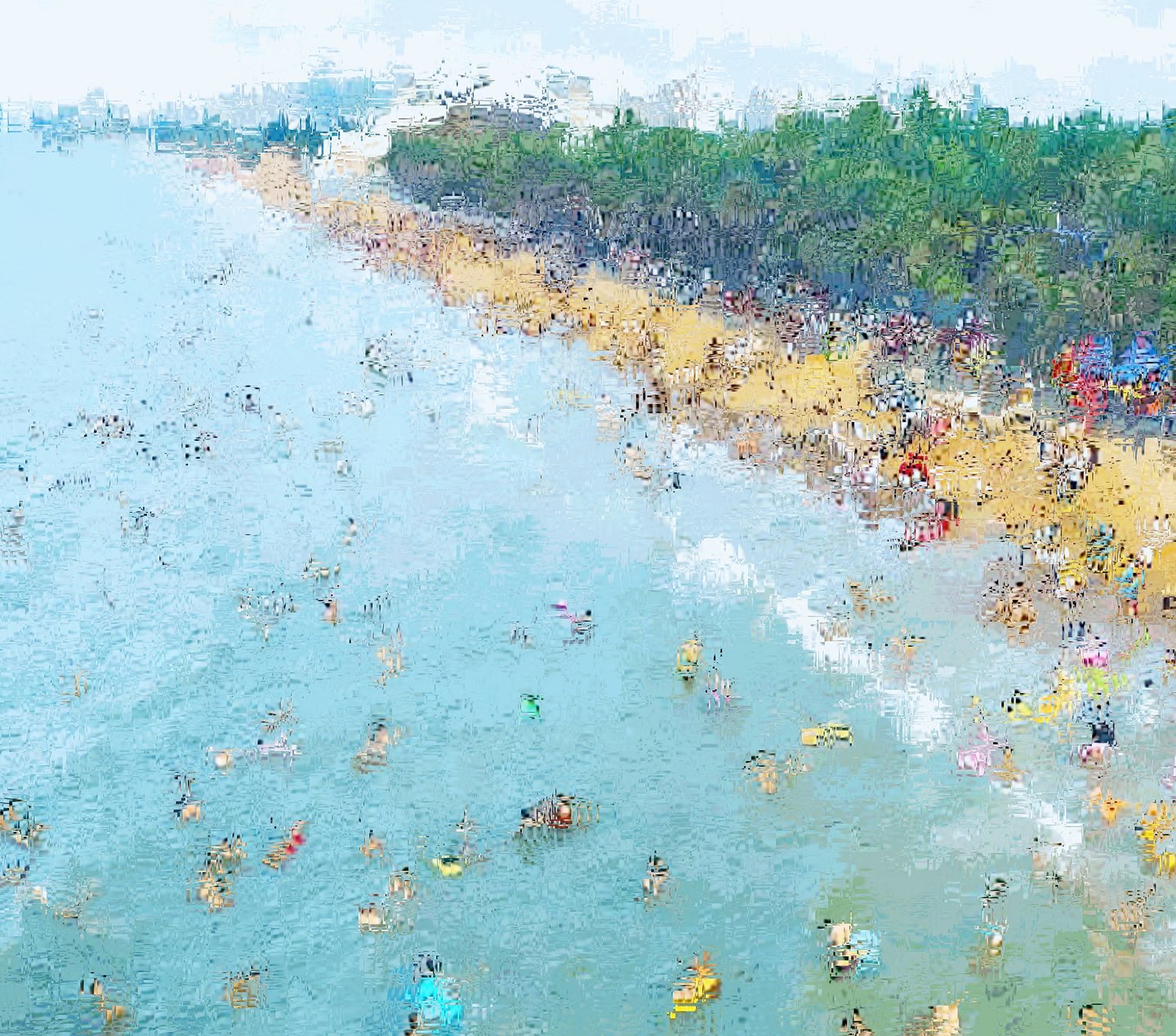a beach scene with a large amount of people on the beach