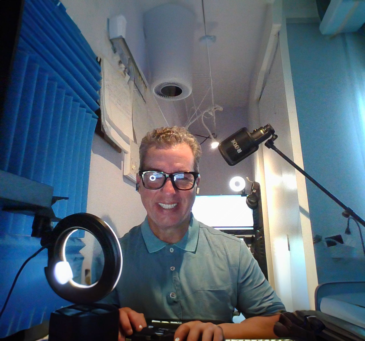 Eric DeRise, a dynamic Instructional Designer and Video Producer working in his studio.