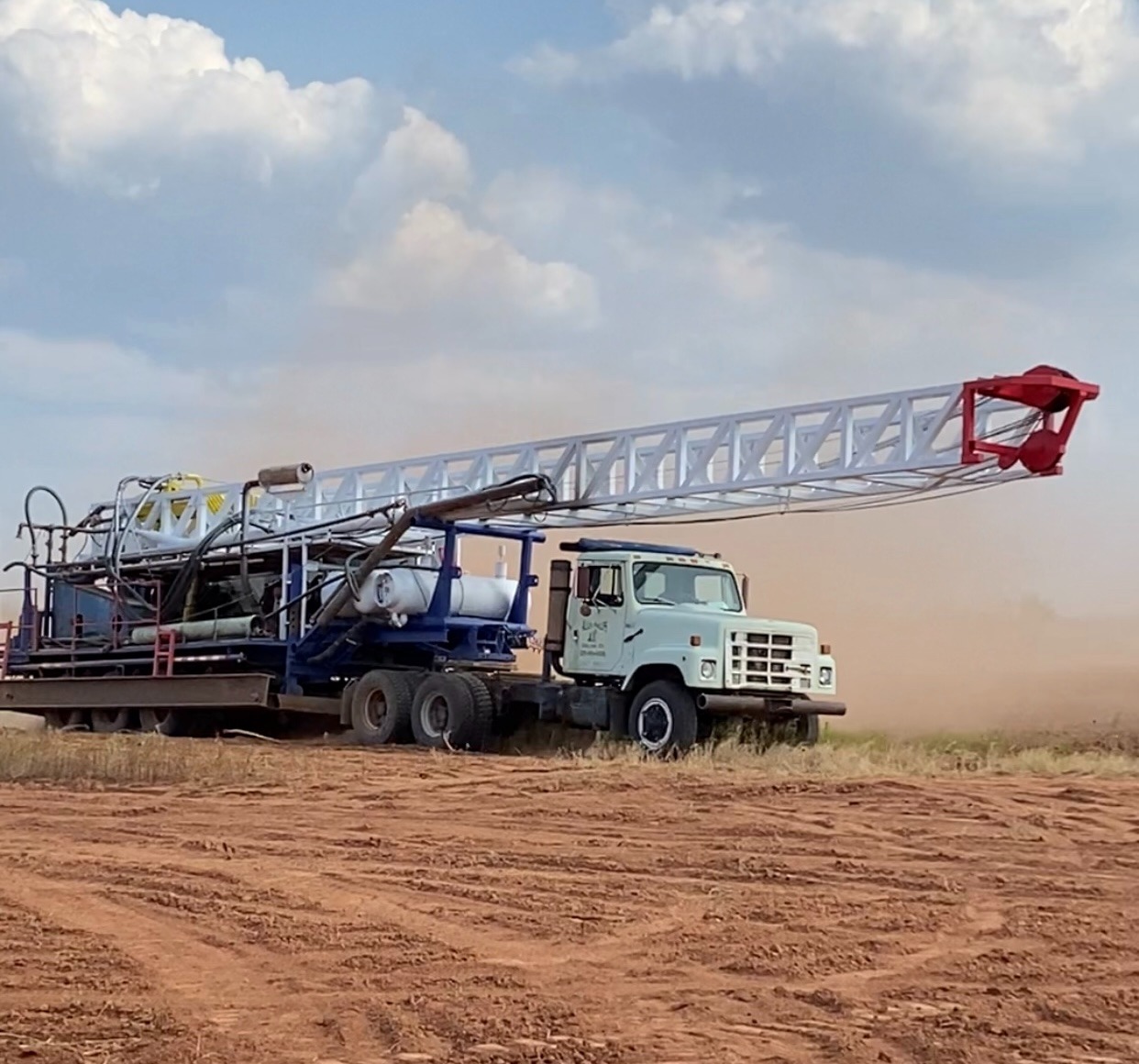 Phillips Drilling truck pulling drilling rig