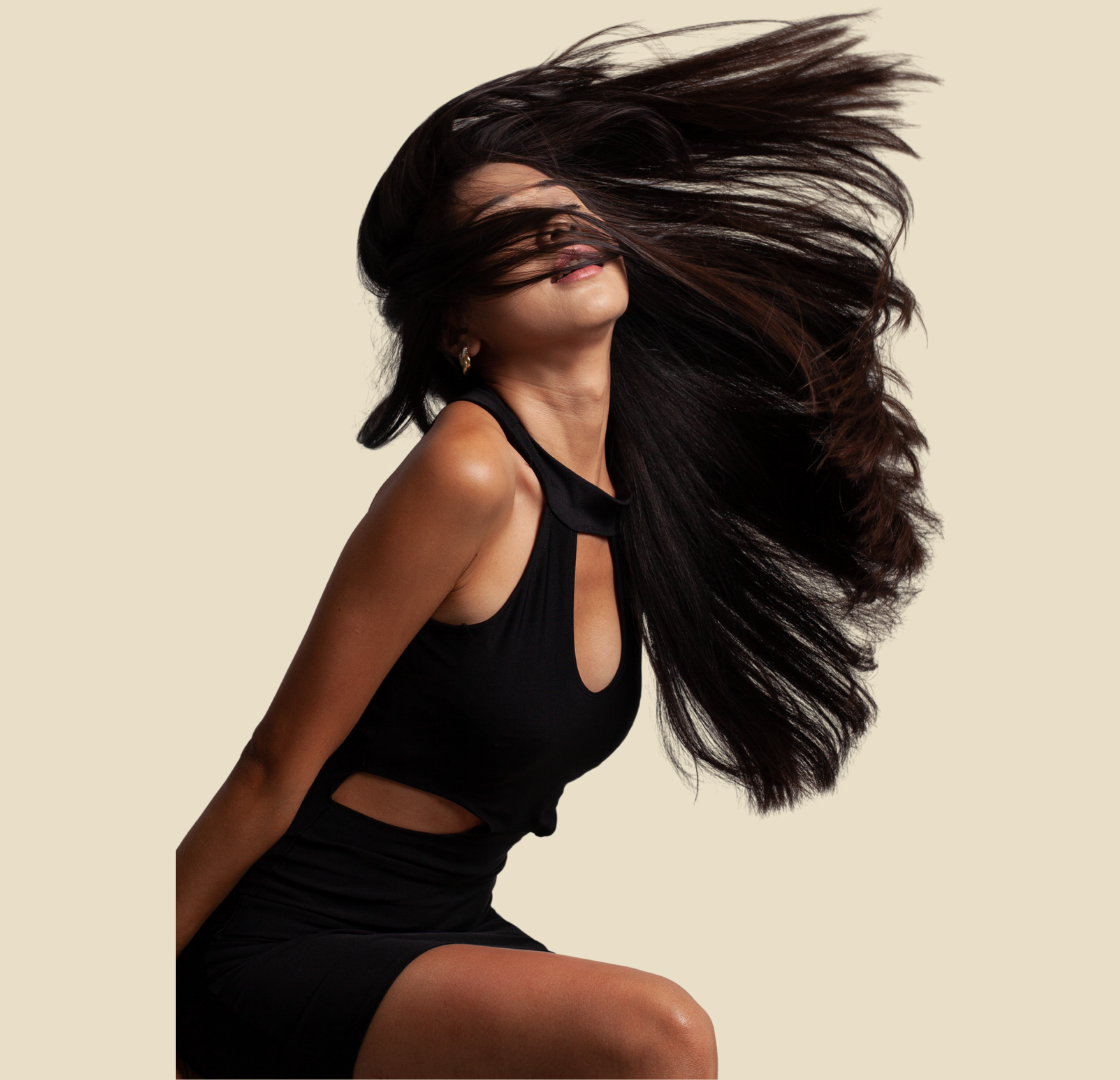 a woman with long hair and a black dress