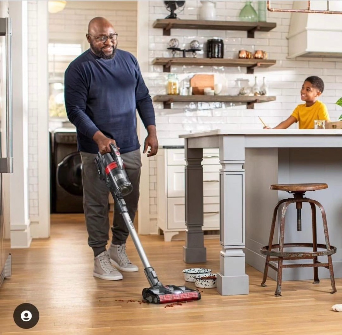 Man with a vacuum cleaning up pet food in a photoshoot