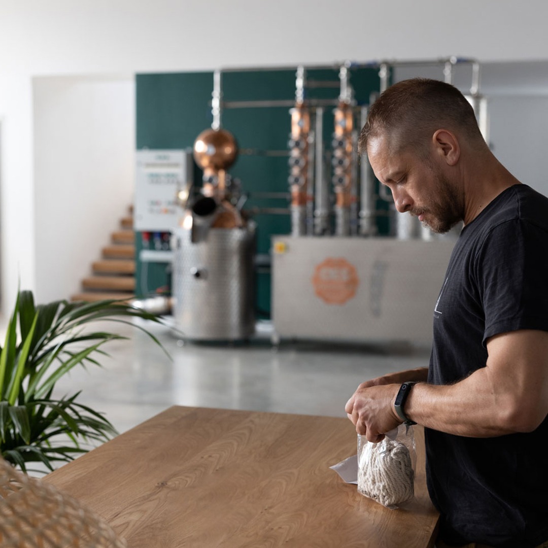 master distiller is sampling botanicals