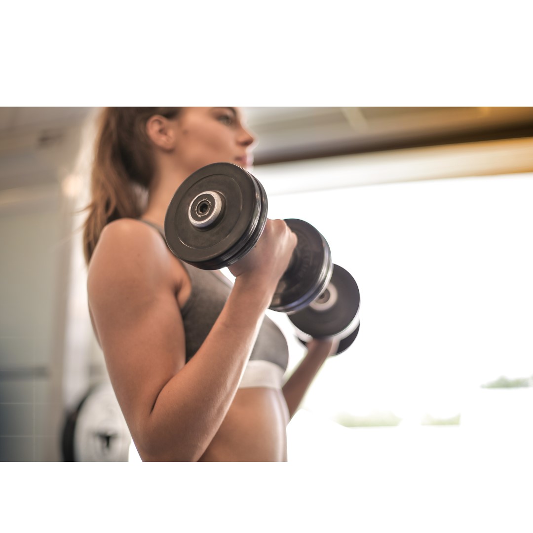 Woman lifting dumbbells for strength training