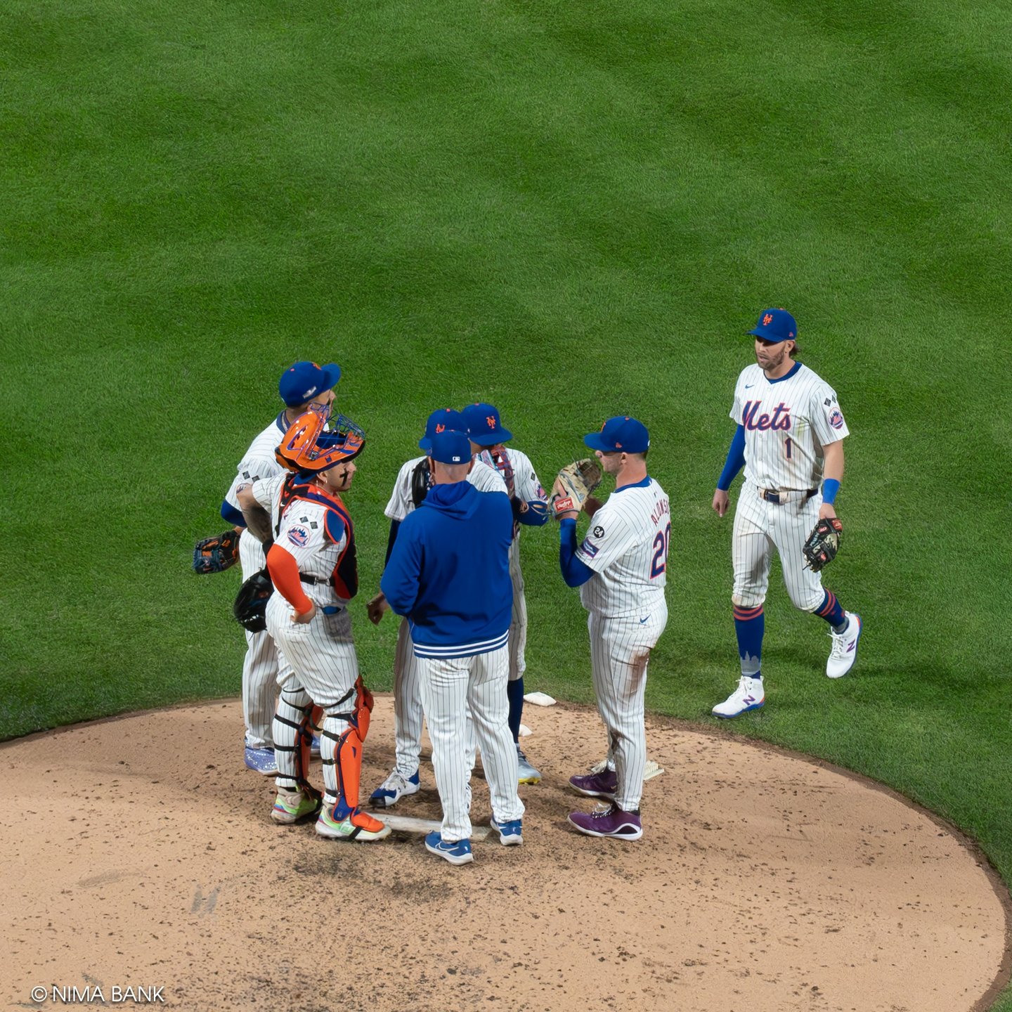 a players mound visit on the pitchers mound on the field