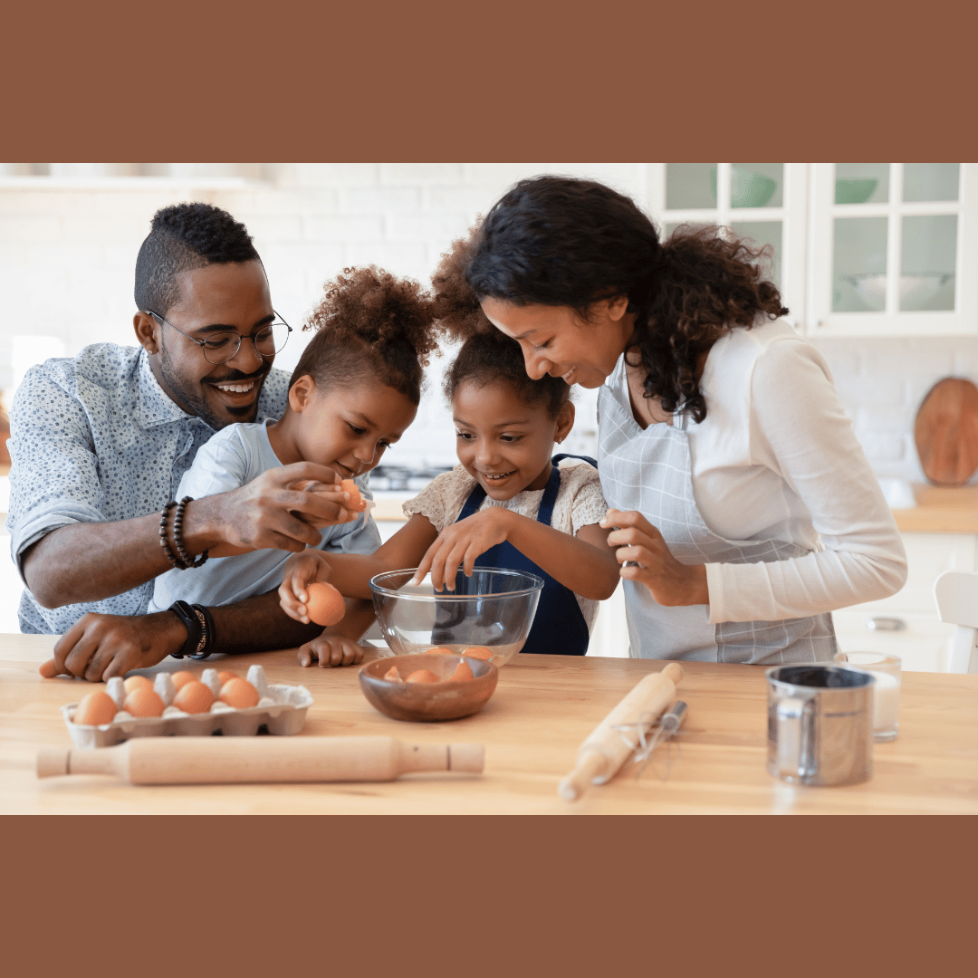 a family breaking eggs as they prepare food together