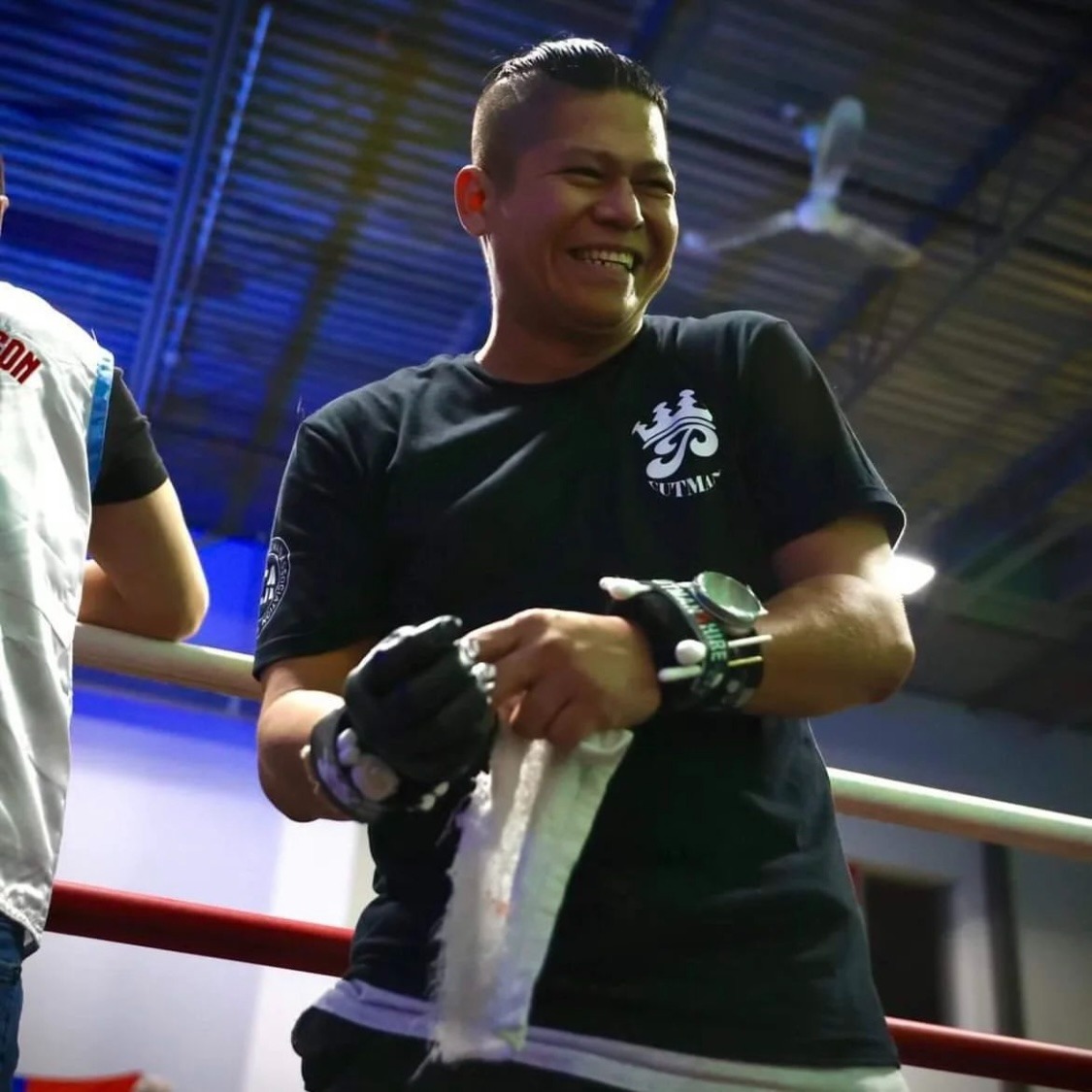 boxing coach philip smiling from the ring