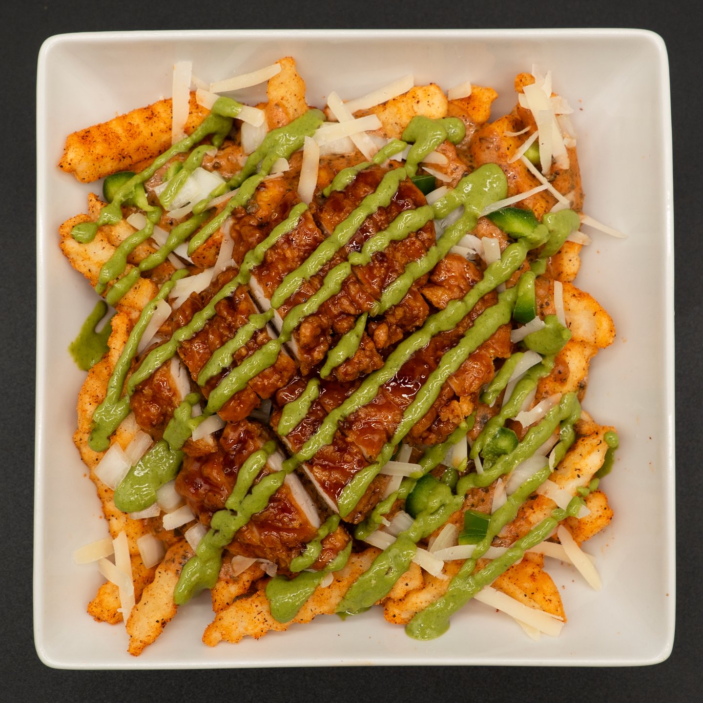 creamy cajun loaded fries with basil aioli