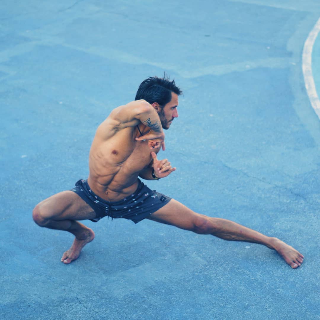 a man is doing a yoga pose from movement snacks online course