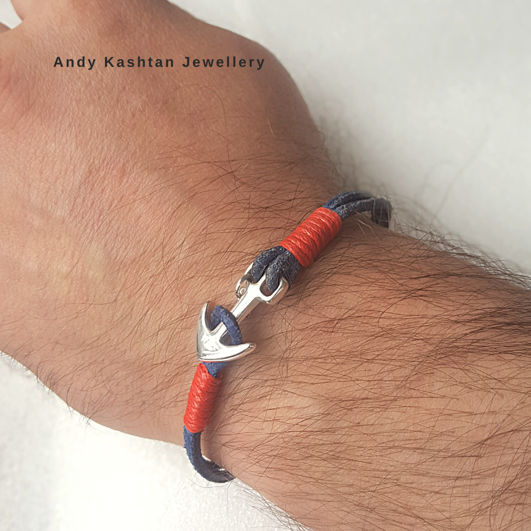 Handmade men's nautical anchor bracelet with silver clasp and blue and red cord.