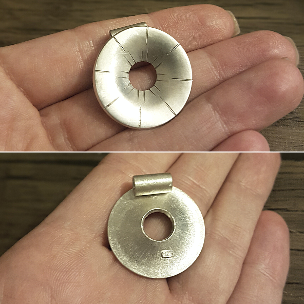 Handcrafted round sterling silver pendant with sunray etched lines held in a person's hand.